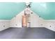 Finished attic featuring turquoise ceilings with ample space and functional storage at 201 Garden Ln, Longwood, FL 32750