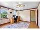 Bedroom features two windows for natural light, alongside a ceiling fan for comfort at 201 Garden Ln, Longwood, FL 32750