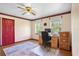 Bedroom with red accents and a ceiling fan, ideal for a home office setup at 201 Garden Ln, Longwood, FL 32750