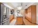 Well-equipped kitchen with stainless steel appliances, oak cabinets, and a center island at 201 Garden Ln, Longwood, FL 32750