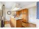 Kitchen with a center island, stainless steel refrigerator, and abundant cabinet space at 201 Garden Ln, Longwood, FL 32750