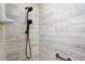 A modern walk-in shower is enhanced by neutral tile walls and dual shower heads at 201 Garden Ln, Longwood, FL 32750
