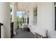 Inviting balcony with elegant columns, comfortable seating, and a relaxing outdoor space at 2036 Brink Aly, Orlando, FL 32814