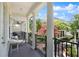 Charming balcony with decorative columns, black railings, and scenic neighborhood views at 2036 Brink Aly, Orlando, FL 32814