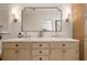 Bright bathroom featuring a dual sink vanity with marble countertops, stylish lighting, and a large mirror at 2036 Brink Aly, Orlando, FL 32814