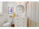 Clean bathroom featuring a toilet, vanity, framed mirror, and a shower with striped curtain at 2036 Brink Aly, Orlando, FL 32814
