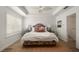 Bright bedroom featuring a ceiling fan, wood floors, and shuttered windows at 2036 Brink Aly, Orlando, FL 32814