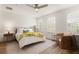 Bright bedroom with ample natural light, ceiling fan, and stylish decor at 2036 Brink Aly, Orlando, FL 32814