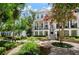 Charming townhouse featuring a beautiful exterior, lush landscaping, and a welcoming entrance at 2036 Brink Aly, Orlando, FL 32814