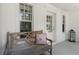 Inviting front porch with bench seating, decorative pillow, and stylish black lantern at 2036 Brink Aly, Orlando, FL 32814