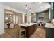 Spacious kitchen boasts a large island, custom cabinets, and stainless steel appliances at 2036 Brink Aly, Orlando, FL 32814