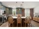 Updated kitchen features stainless steel appliances, a large island, and pendant lights at 2036 Brink Aly, Orlando, FL 32814
