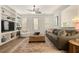 Cozy living room featuring built-in shelves, shuttered windows, and comfortable seating at 2036 Brink Aly, Orlando, FL 32814