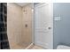 Bathroom features a walk in shower with modern shower head and tile surround at 205 9Th St, St Cloud, FL 34769