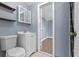 Bathroom featuring a modern sink, storage, shelving and an open doorway at 205 9Th St, St Cloud, FL 34769