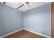A simple bedroom features clean, painted walls, new flooring, and modern ceiling fan at 205 9Th St, St Cloud, FL 34769