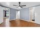 Bedroom with natural light, new flooring, ceiling fan, and access to other rooms at 205 9Th St, St Cloud, FL 34769
