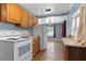 Open kitchen showcases oak cabinets and modern appliances at 205 9Th St, St Cloud, FL 34769