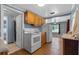 This open kitchen showcases oak cabinets and modern appliances at 205 9Th St, St Cloud, FL 34769