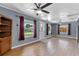 Bright living room featuring hardwood floors, neutral walls, and two ceiling fans at 205 9Th St, St Cloud, FL 34769