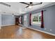 Bright living room with hardwood floors and two ceiling fans at 205 9Th St, St Cloud, FL 34769