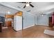Open floor plan, shows the kitchen, living room with hardwood floors, and neutral walls at 205 9Th St, St Cloud, FL 34769