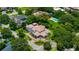 Expansive estate featuring a swimming pool, lush greenery, and a well-manicured lawn, offering ultimate privacy at 2211 Azalea Pl, Winter Park, FL 32789