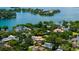 Stunning aerial view of a lakefront community with beautiful homes and lush green trees at 2211 Azalea Pl, Winter Park, FL 32789
