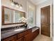 Bathroom featuring granite counters, shutters, and a tub with a shower at 2211 Azalea Pl, Winter Park, FL 32789