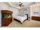 Comfortable bedroom with an aquarium, a ceiling fan, and neutral decor at 2211 Azalea Pl, Winter Park, FL 32789