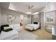 Inviting bedroom with a sofa, bed, and cozy seating area, creating a relaxing retreat at 2211 Azalea Pl, Winter Park, FL 32789