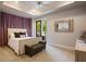 Inviting bedroom with neutral palette, plush carpeting, and French doors leading to an outside terrace at 2211 Azalea Pl, Winter Park, FL 32789