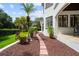 Beautiful home exterior with a lush garden path leading to the entrance at 2211 Azalea Pl, Winter Park, FL 32789