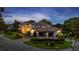Stately home with covered parking, lush greenery, and distinctive architecture, perfect for luxurious living at 2211 Azalea Pl, Winter Park, FL 32789