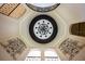 Stunning foyer ceiling featuring detailed trim, chandelier and wrought iron balcony at 2211 Azalea Pl, Winter Park, FL 32789