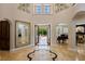 Spacious foyer with marble floors, grand mirror, and views to the outdoor living space at 2211 Azalea Pl, Winter Park, FL 32789