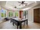 Well-lit game room featuring a pool table, comfortable seating, and bright windows at 2211 Azalea Pl, Winter Park, FL 32789