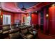 Private home theater with plush leather seating, projector, and custom lighting for ultimate viewing at 2211 Azalea Pl, Winter Park, FL 32789