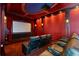 Experience cinematic luxury in this home theater, boasting plush seating and immersive visuals at 2211 Azalea Pl, Winter Park, FL 32789
