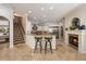 The kitchen features custom cabinets, a breakfast bar with seating, and stainless steel appliances at 2211 Azalea Pl, Winter Park, FL 32789
