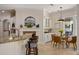 Kitchen with breakfast bar, fireplace, and casual dining area with a glass top table at 2211 Azalea Pl, Winter Park, FL 32789