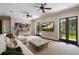 Expansive living room with French doors, built-in shelving, and comfortable seating arrangement at 2211 Azalea Pl, Winter Park, FL 32789