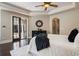 Elegant main bedroom features dark wood floors and french doors leading to the outdoor space at 2211 Azalea Pl, Winter Park, FL 32789