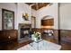 Well-appointed office space featuring a cozy fireplace and custom built-in cabinets for ample storage at 2211 Azalea Pl, Winter Park, FL 32789