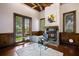 Bright office with coffered ceiling, fireplace and built-in shelving, overlooking the lush outdoors at 2211 Azalea Pl, Winter Park, FL 32789