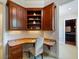 Cozy built-in office nook featuring custom cabinets and shelving, creating an ideal workspace at 2211 Azalea Pl, Winter Park, FL 32789