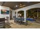 Covered outdoor seating area with dining and bar area overlooking the pool at 2211 Azalea Pl, Winter Park, FL 32789