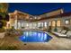 An in-ground pool with an attached spa is centered in the backyard with an outdoor seating and dining area at 2211 Azalea Pl, Winter Park, FL 32789