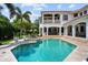 Elegant backyard showcasing a sparkling pool, spa, and covered patio area at 2211 Azalea Pl, Winter Park, FL 32789