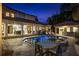 An in-ground pool with an attached spa is centered in the patio and is near an outdoor dining area and bar at 2211 Azalea Pl, Winter Park, FL 32789